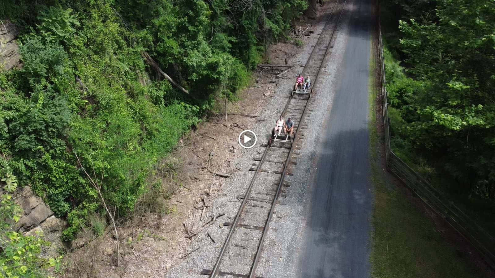 Drone view over the Tunnel Hotel grounds and GAP trail corridor in Frostburg, Maryland, showing the inn and camping field