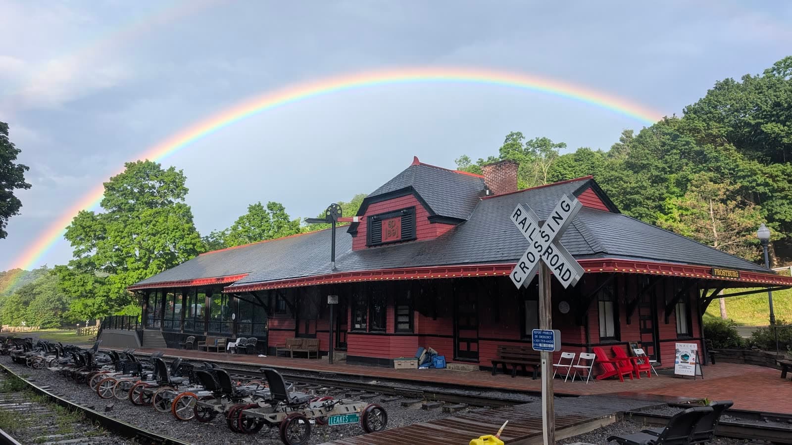 A rainbow over the Frostburg depot with railbikes lined up on the track