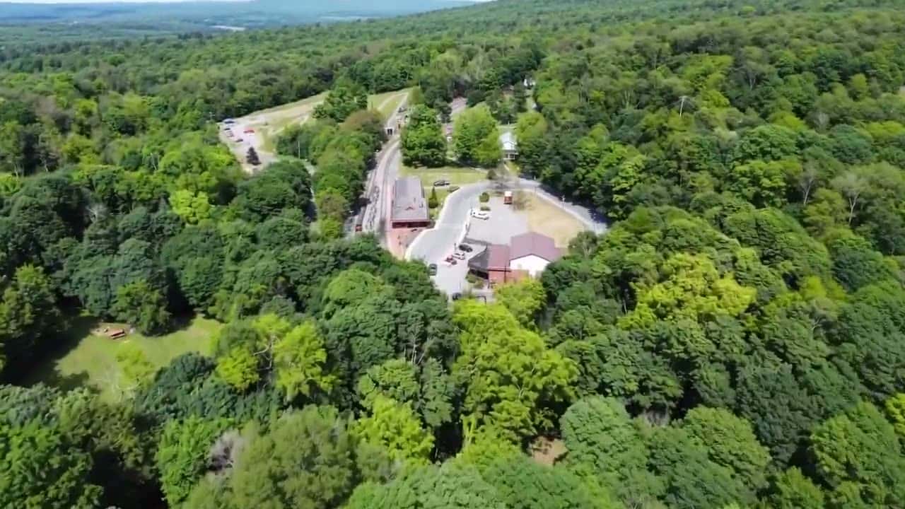 The Tunnel Hotel and Tracks & Yaks: aerial footage of the property, railbiking the Great Allegheny Passage line, the Brush Tunnel, the steam locomotive at the Frostburg depot, and the campground
