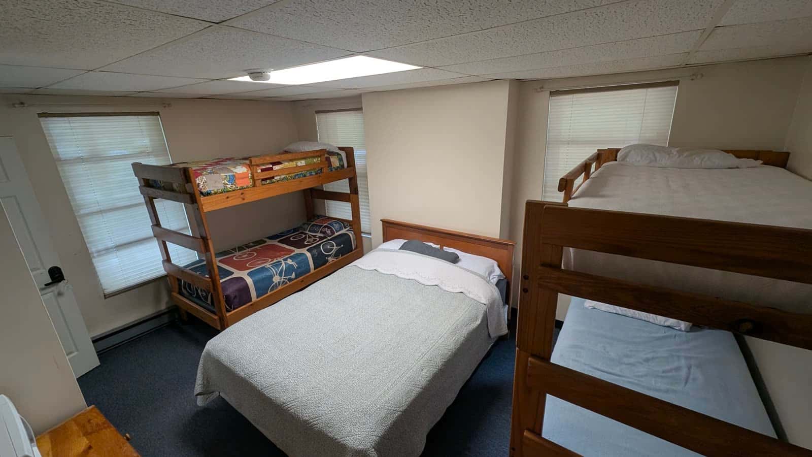 Big Savage Bunk Room with queen bed and bunk sets at the Tunnel Hotel near the GAP trail in Frostburg, Maryland