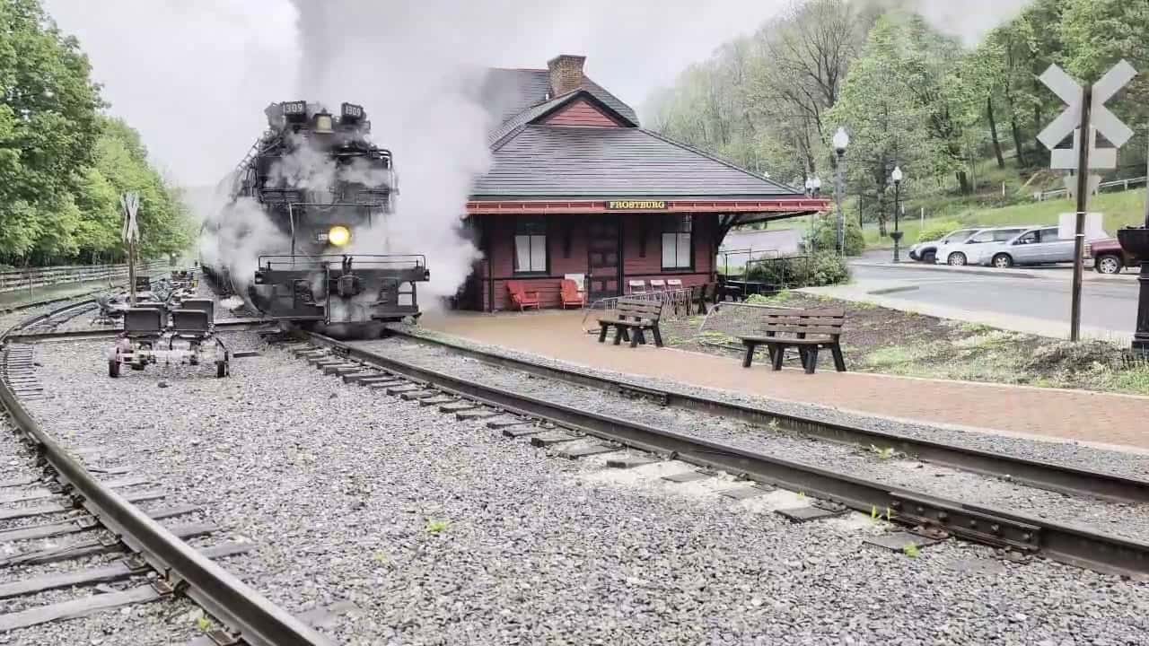 The Frostburg Flyer pulling into the Frostburg, Maryland depot beside The Tunnel Hotel near the Great Allegheny Passage