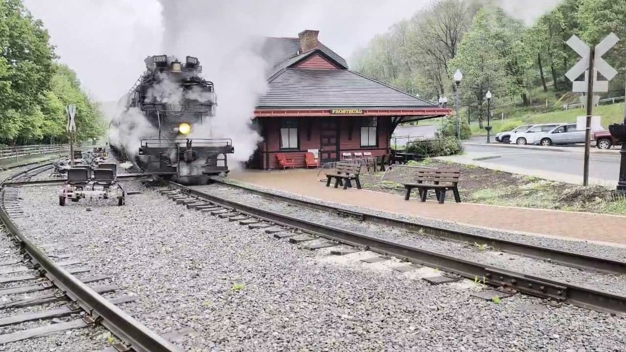 The Western Maryland Scenic Railroad steam locomotive arriving at the Frostburg depot, railbikes parked on the near track